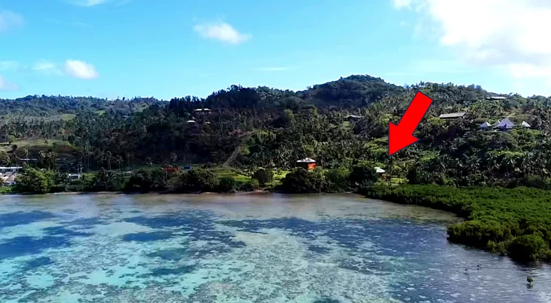 Aerial photo of the lagoon and hills with the house marked